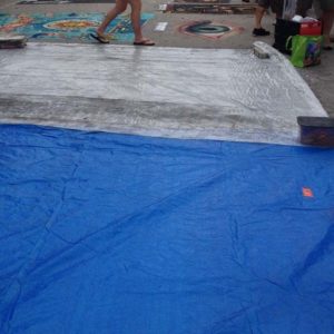 tarps covering art pieces.