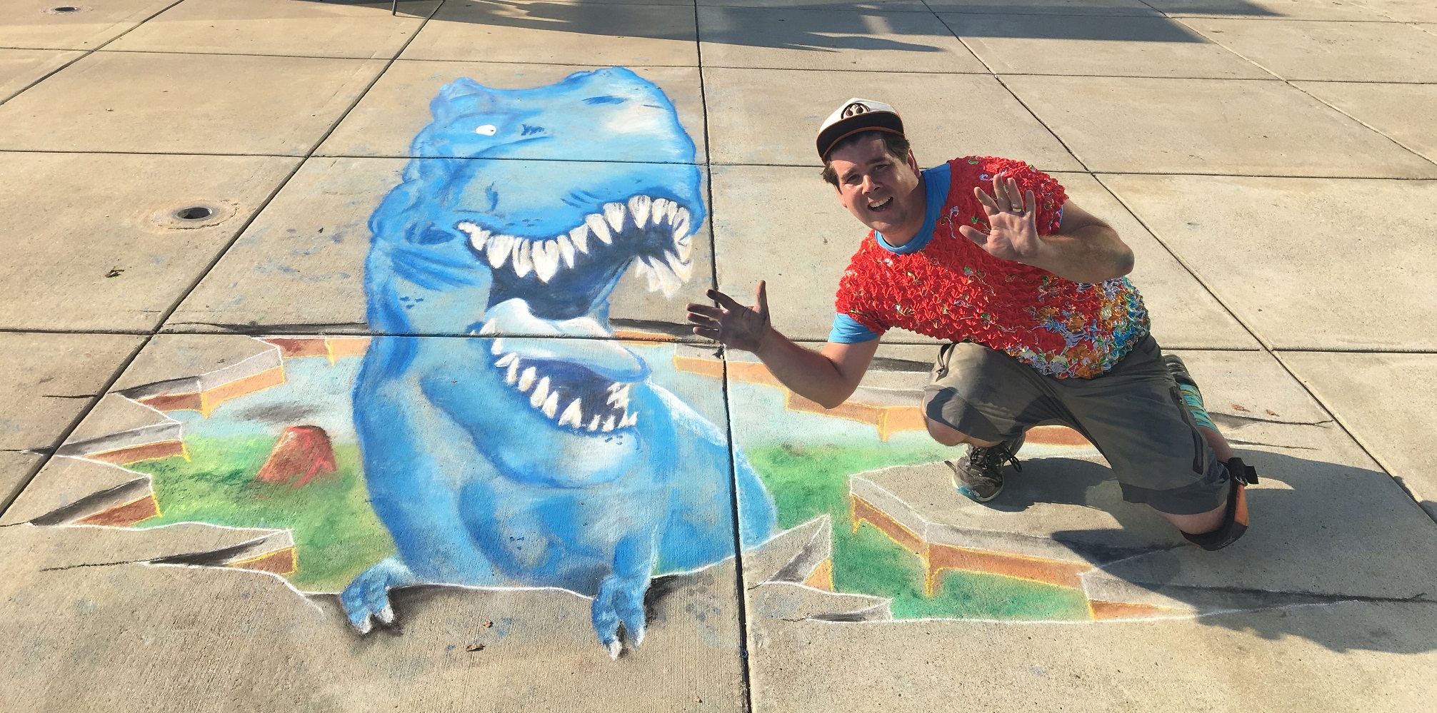 Zach poses with a T-Rex Dinosaur 3D Chalk Art